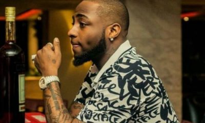 Davido Expresses Shock As Strange Woman Tattoos His Family On Her Back. 55