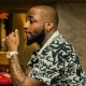 Davido Expresses Shock As Strange Woman Tattoos His Family On Her Back. 56